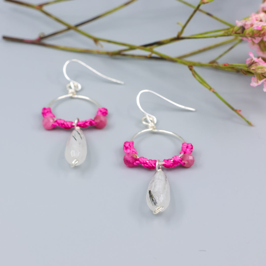detail view of handmade sterling silver hoop earrings with tourmalated quartz and pink tourmaline beads