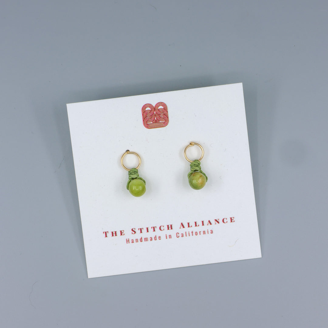 peridot mini dangle earring gold fill handmade on a white card