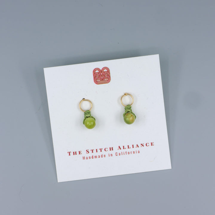 peridot mini dangle earring gold fill handmade on a white card