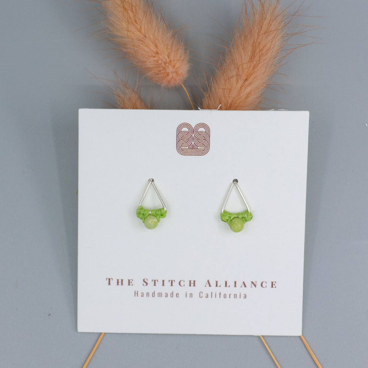 handmade peridot stud earrings sterling silver triangle on white card