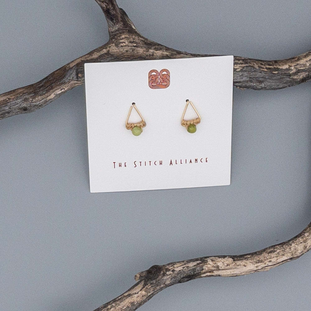 Peridot triangle earring 14k gold fill on a gray background