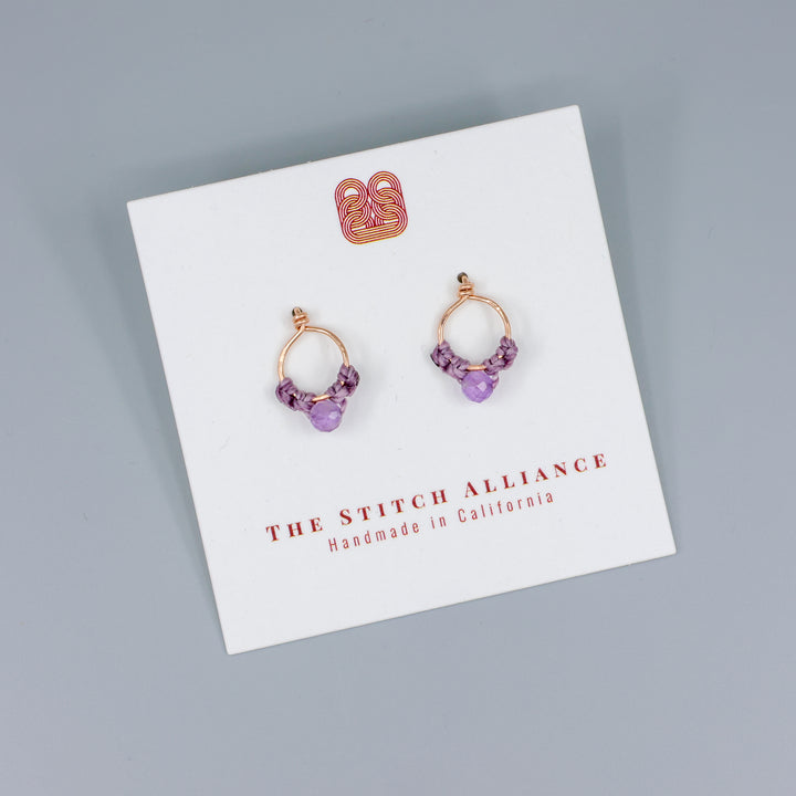 handmade rose gold macrame stud earrings with amethyst beads on a white card