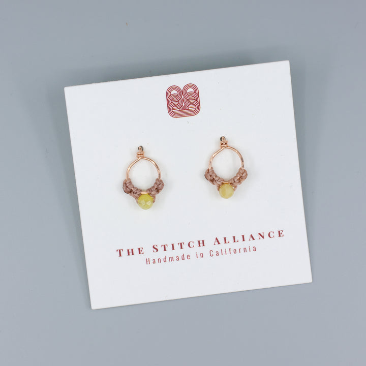 rose gold and yellow opal handmade stud earrings with macrame on a white card