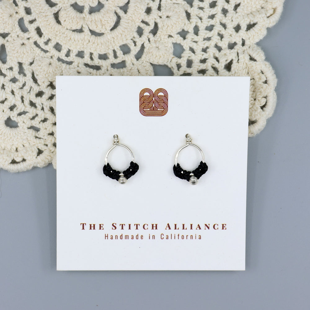 handmade sterling silver macrame stud earrings on a white card