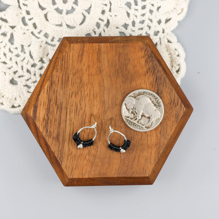 handmade sterling silver macrame stud earrings with a nickel for size comparison