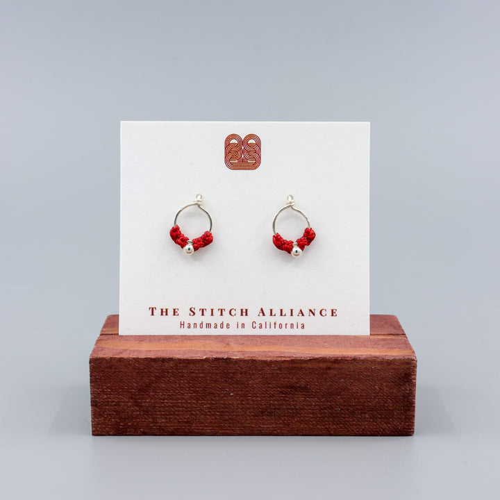 handmade sterling silver red macrame earrings on a white card