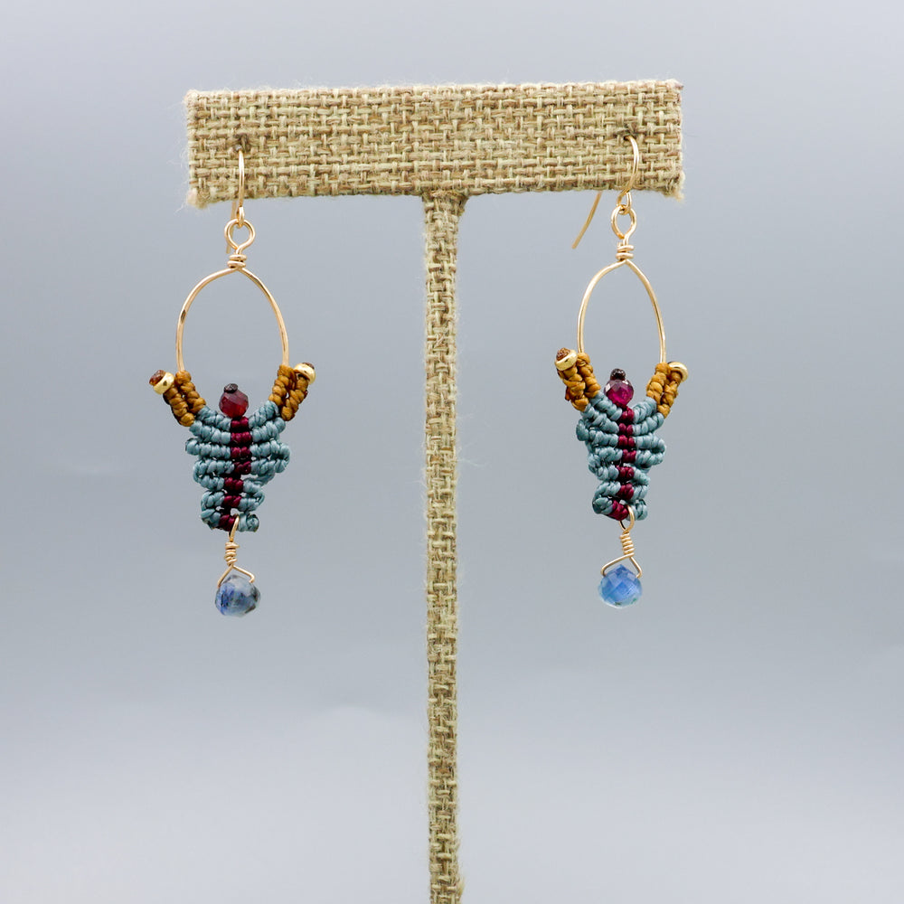 handmade macrame earrings with kyanite and garnet beads in 14k gold fill on a linen hanger