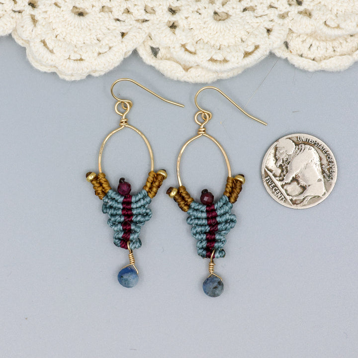 handmade macrame earrings with kyanite and garnet beads in 14k gold fill with a coin for size comparison