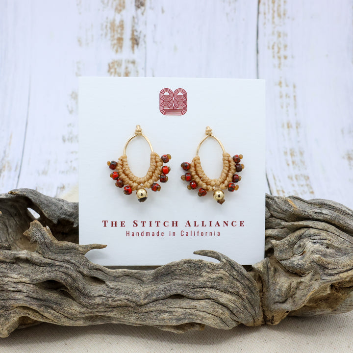 14k gold filled handmade macrame earrings in tan with red beads on a white card