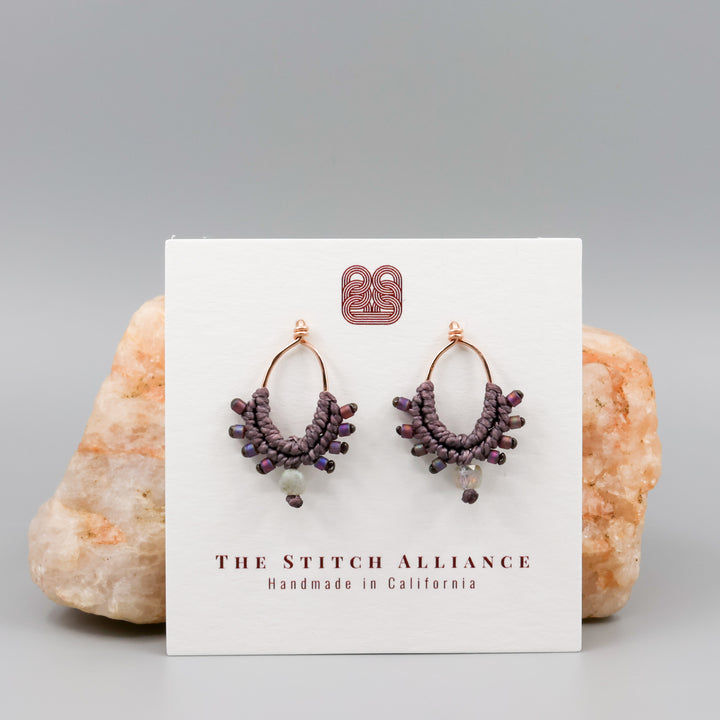 dusty purple rose gold macrame earrings on a white card