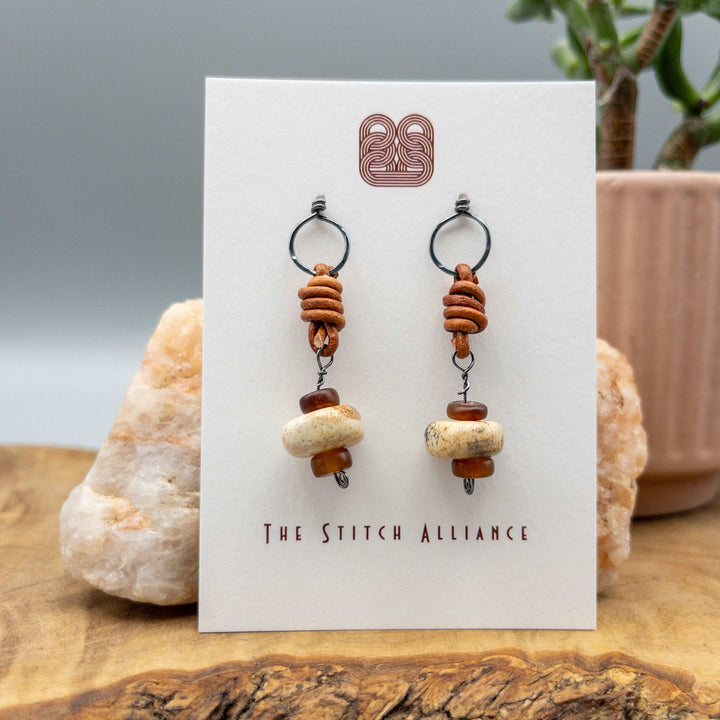 Picture jasper, horn, leather, and oxidized sterling silver drop earrings on a white card