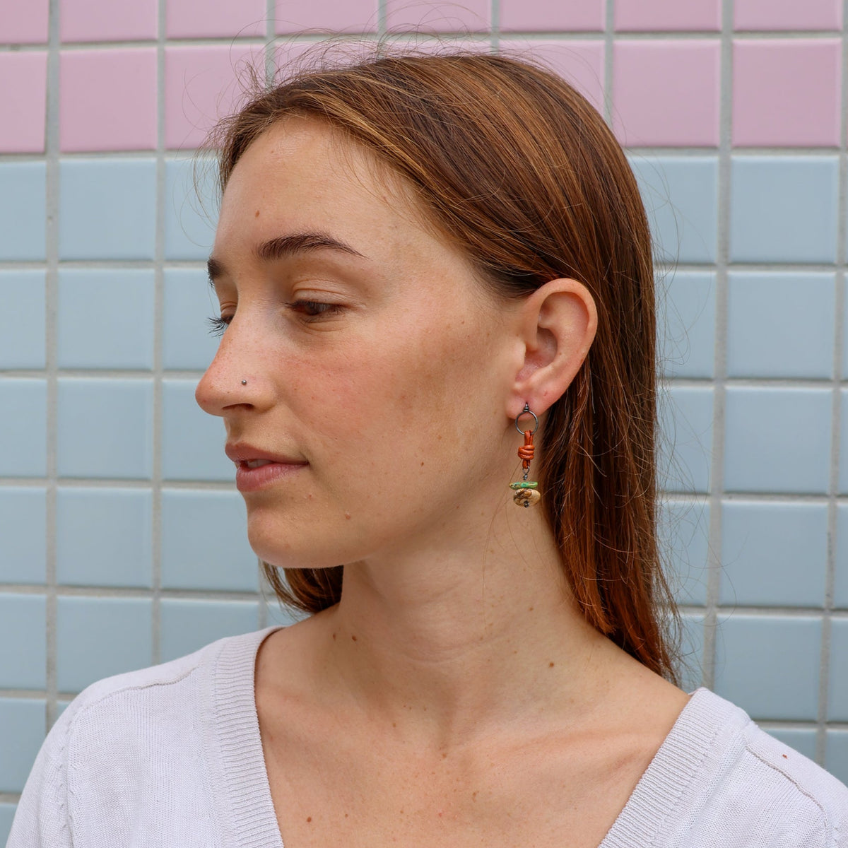picture jasper and turquoise handmade earrings worn on a model