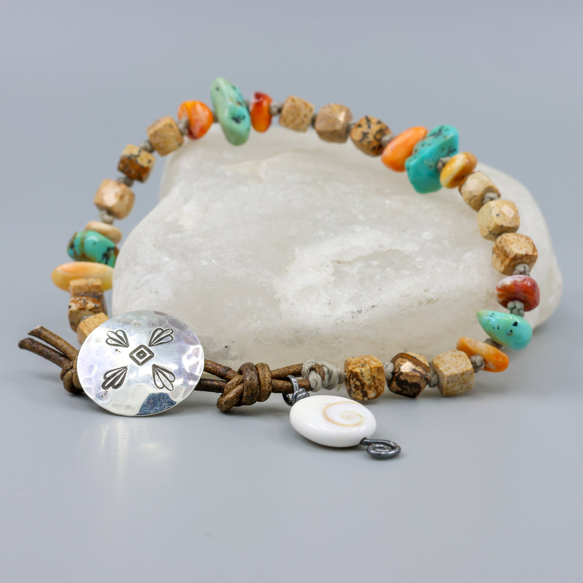 Picture Jasper, Turquoise, and Spiny Oyster handmade bracelet with leather and sterling silver button closure on crystal rock