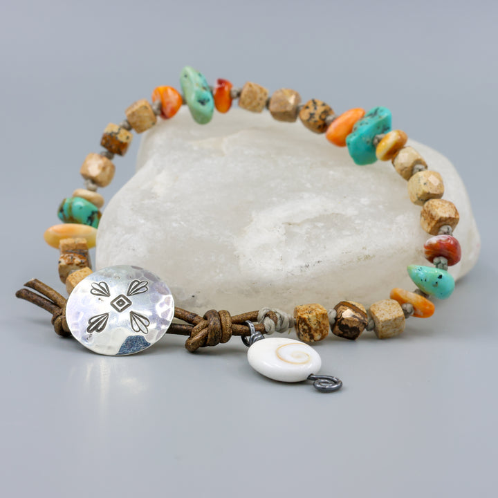 Picture Jasper, Turquoise, and Spiny Oyster handmade bracelet with leather and sterling silver button closure on crystal rock