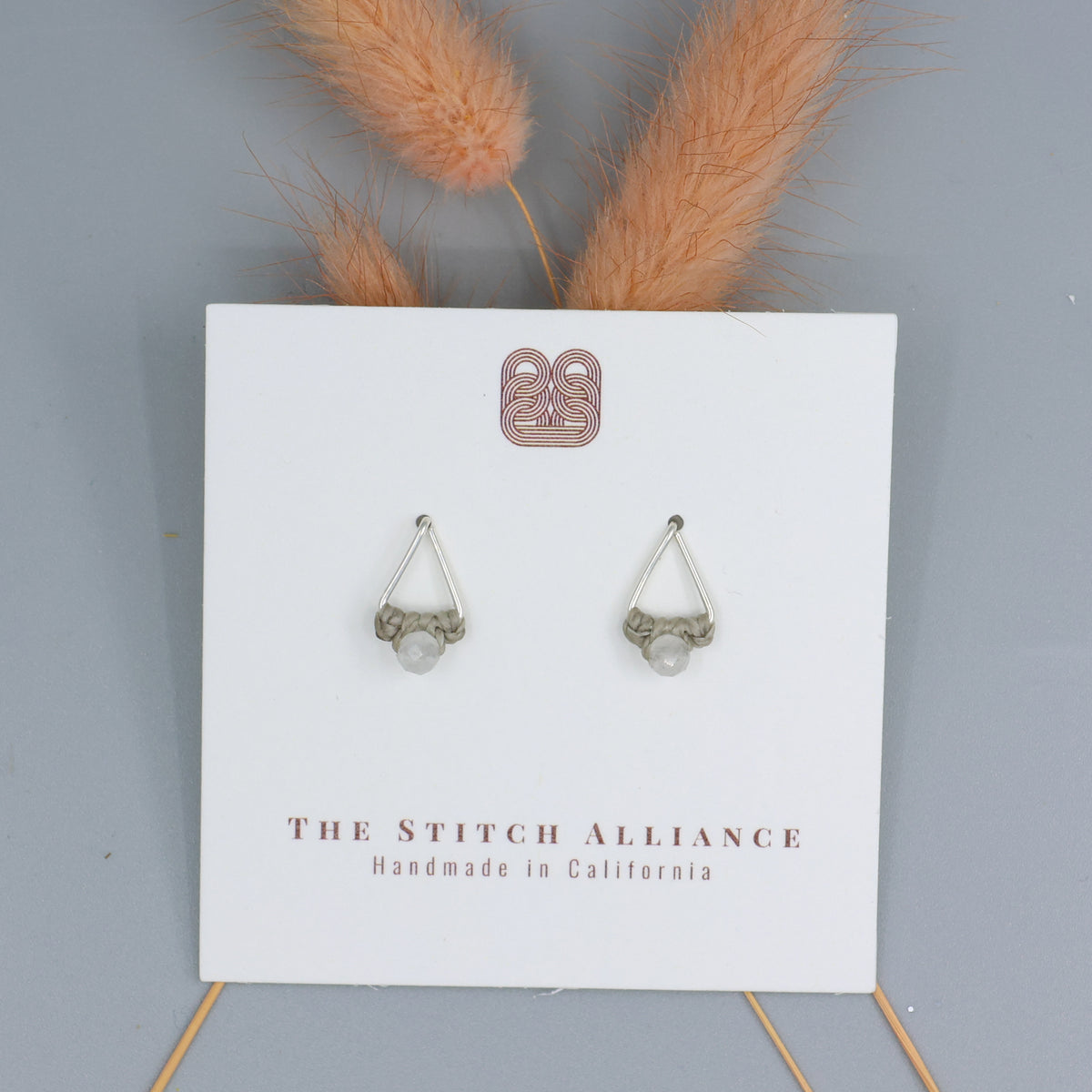 rainbow moonstone studs sterling silver triangle on a white card