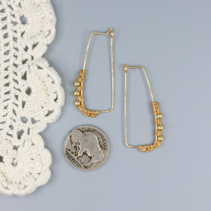 gold filled rectangle macrame hoop earrings with a nickel for size comparison