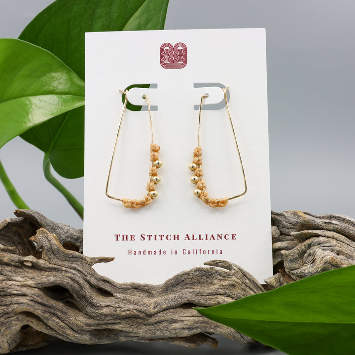 gold filled rectangle macrame hoop earrings on a white card