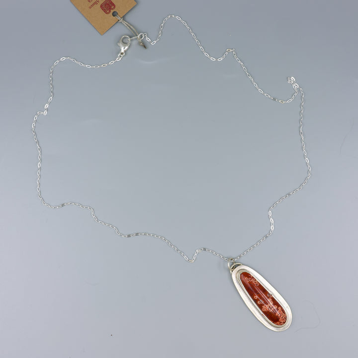 handmade red jasper sterling silver pendant on sterling silver chain overhead view