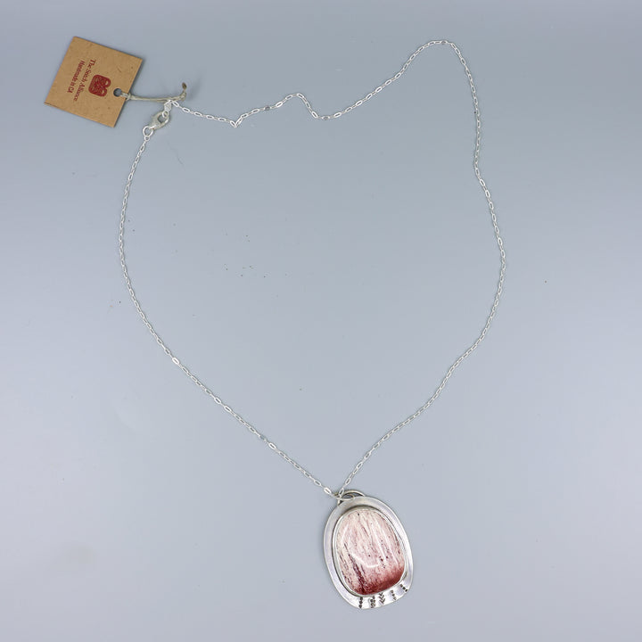 handmade jasper and sterling silver necklace on a gray background
