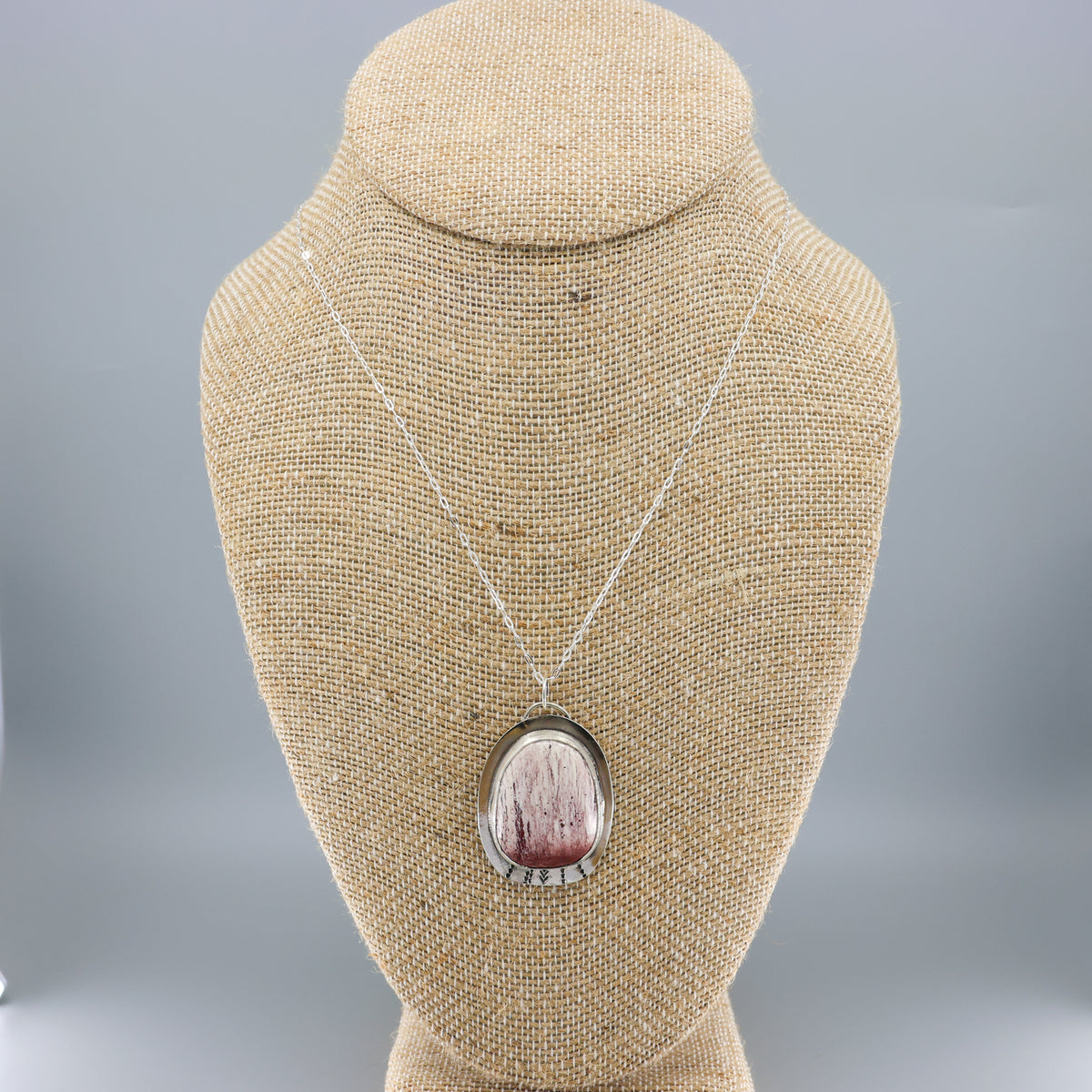 handmade jasper and sterling silver necklace on a mannequin
