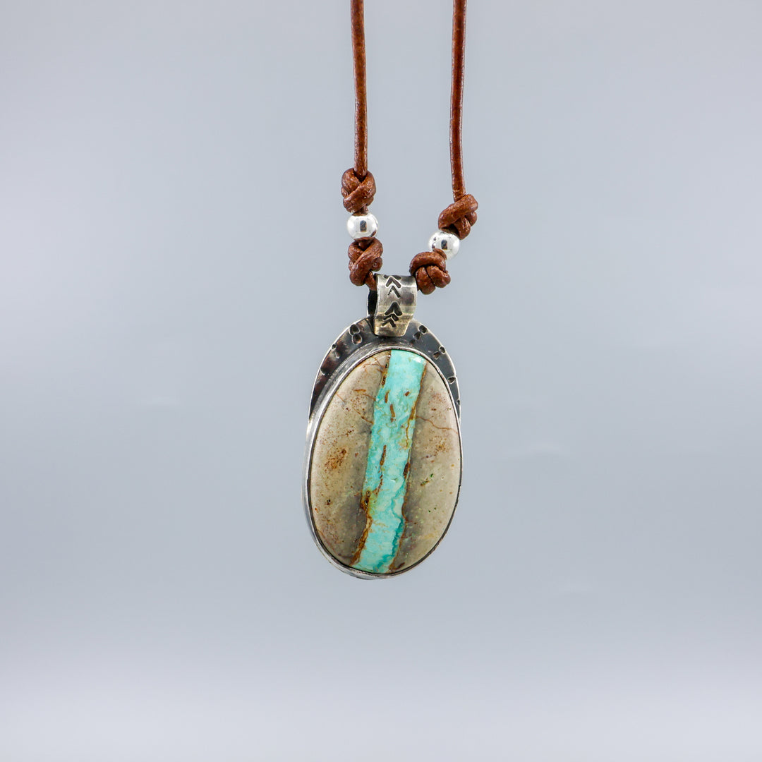 handmade Ribbon turquoise sterling silver pendant on leather cord
