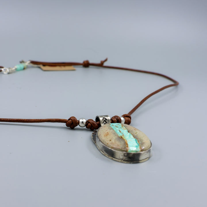 Ribbon turquoise sterling silver pendant on leather cord