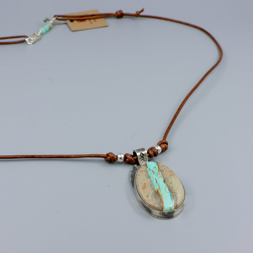 Ribbon turquoise sterling silver pendant on leather cord detail view