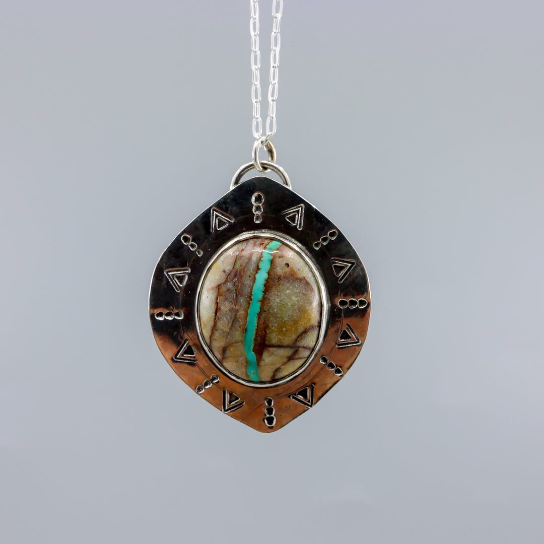 close up view of one of a kind ribbon turquoise sterling silver necklace