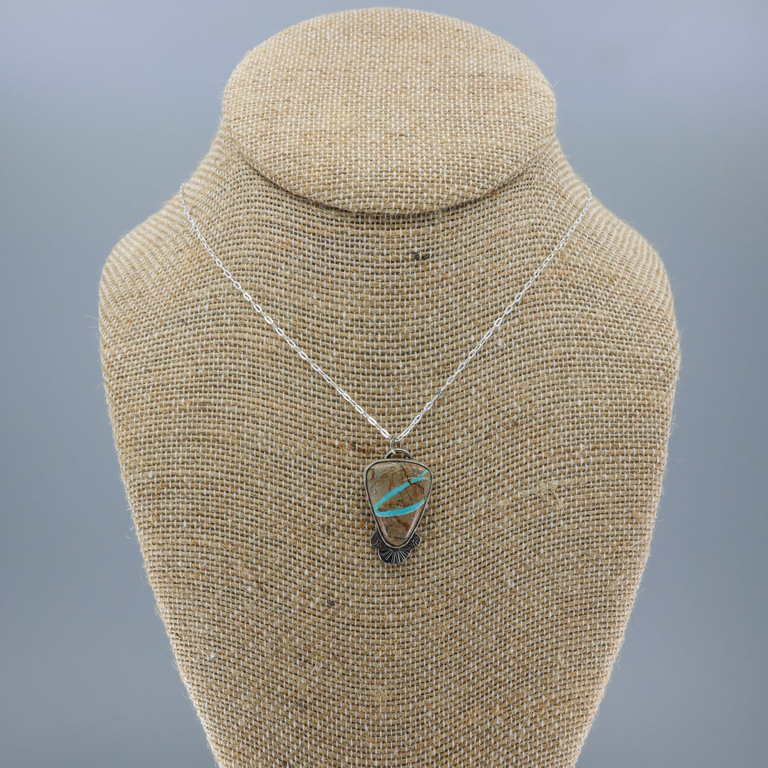 ribbon turquoise pendant one-of-a-kind necklace on a burlap display