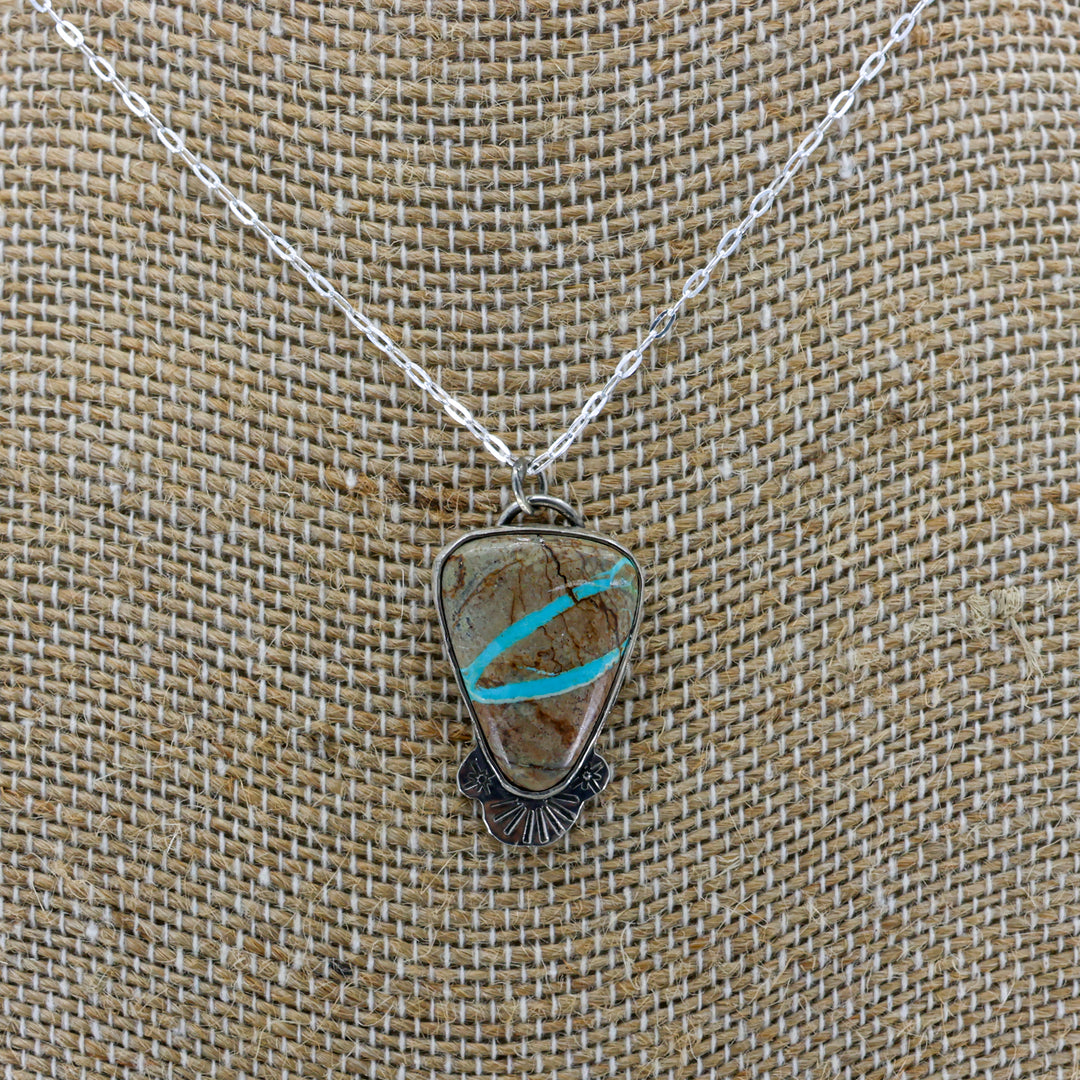 ribbon turquoise pendant one-of-a-kind necklace on a burlap background