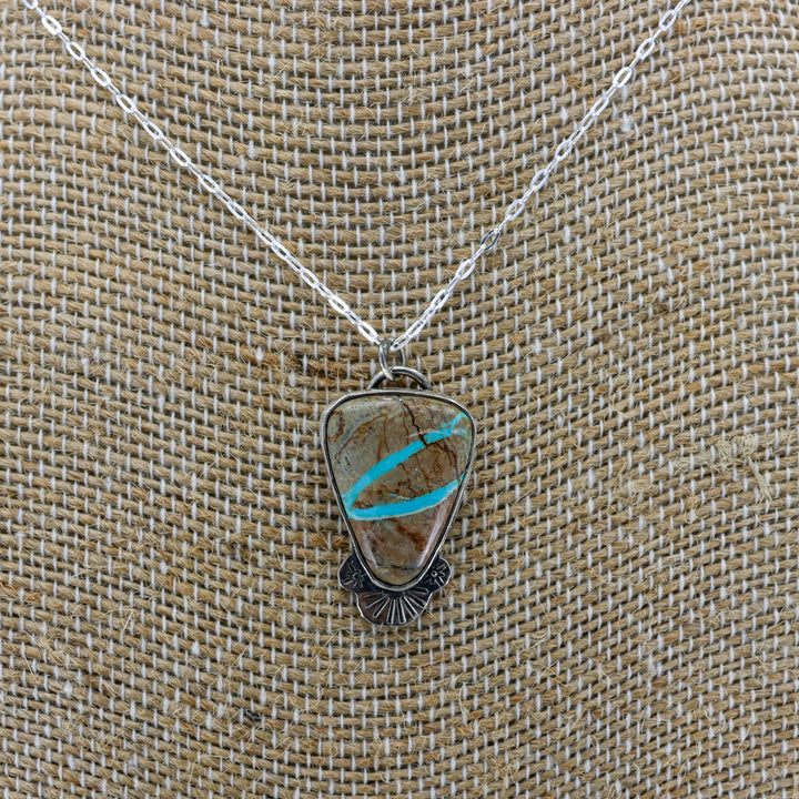 ribbon turquoise pendant one-of-a-kind necklace on a burlap background