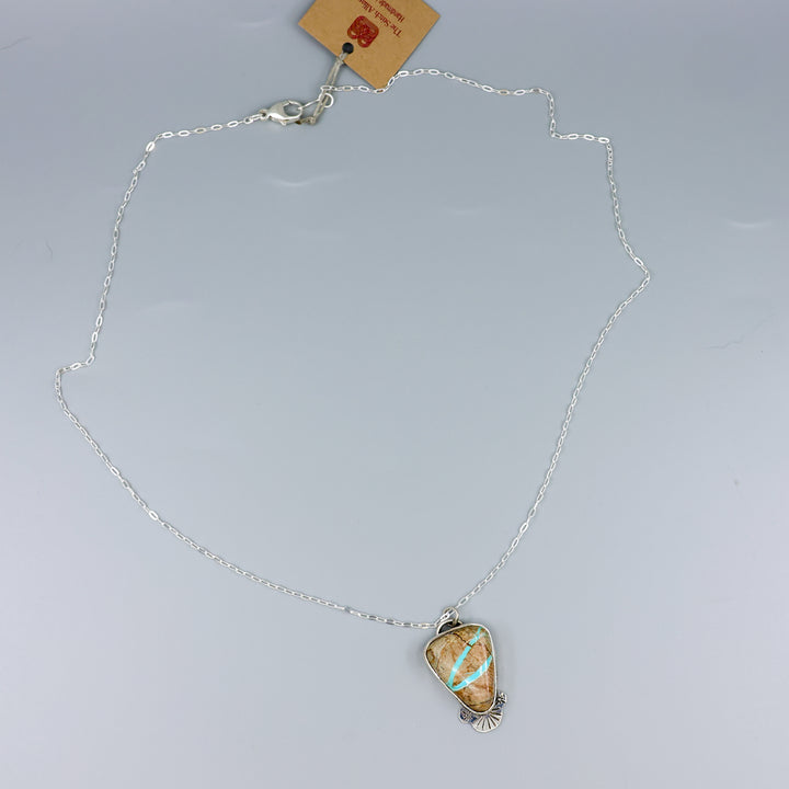 ribbon turquoise pendant one-of-a-kind necklace on a gray background