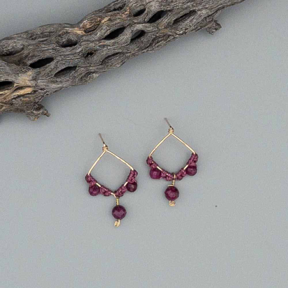 Boho ruby drop earrings gold filled on gray background