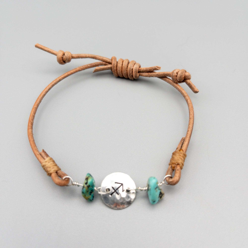 Sagittarius bracelet - sterling silver, turquoise, leather on a gray background