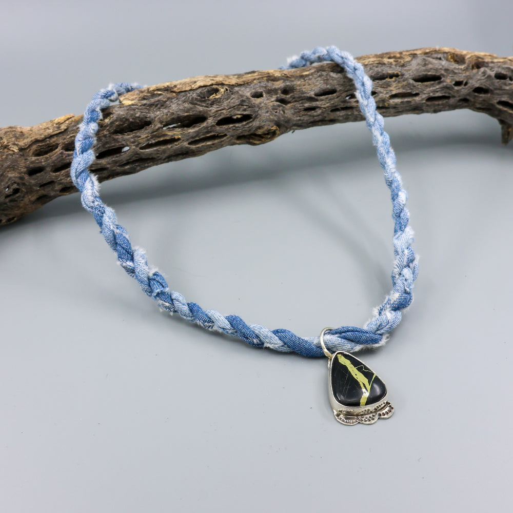 san pedro variscite one of a kind necklace on denim cordage on a gray background