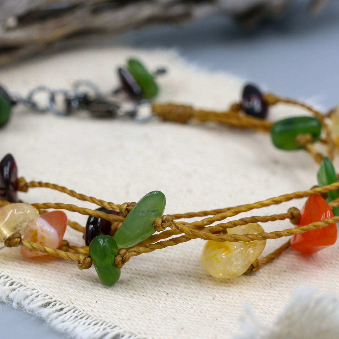 detail of handknotted gemstone, cord, and oxidezed stelring silver bracelet