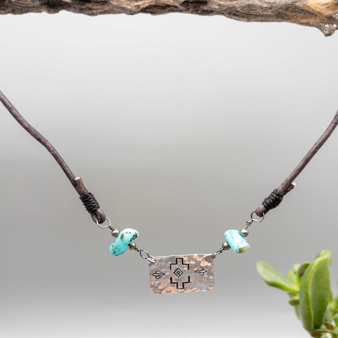 Stamped silver turquoise and leather necklace detail