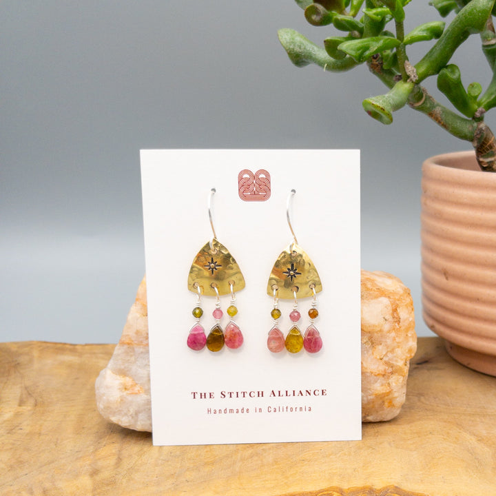 hand stamped brass earrings with tourmaline beads and sterling silver ear wires on a white card