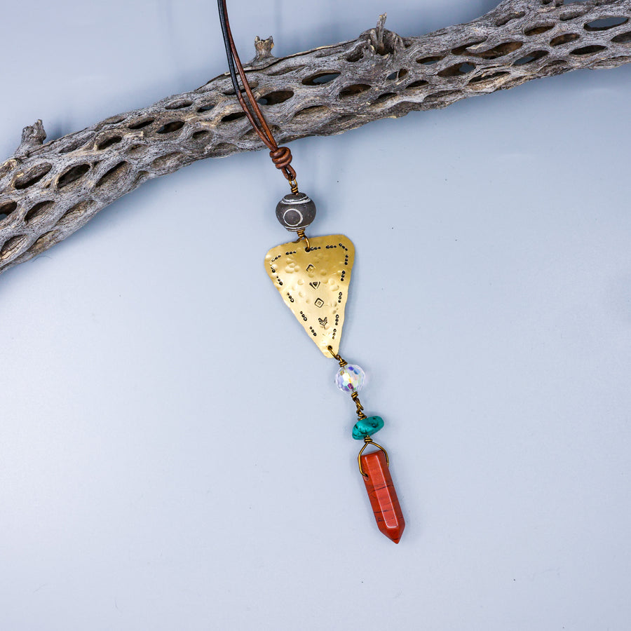 handmade gemstone suncatcher with brass, red jasper, turquoise, and african trade beads