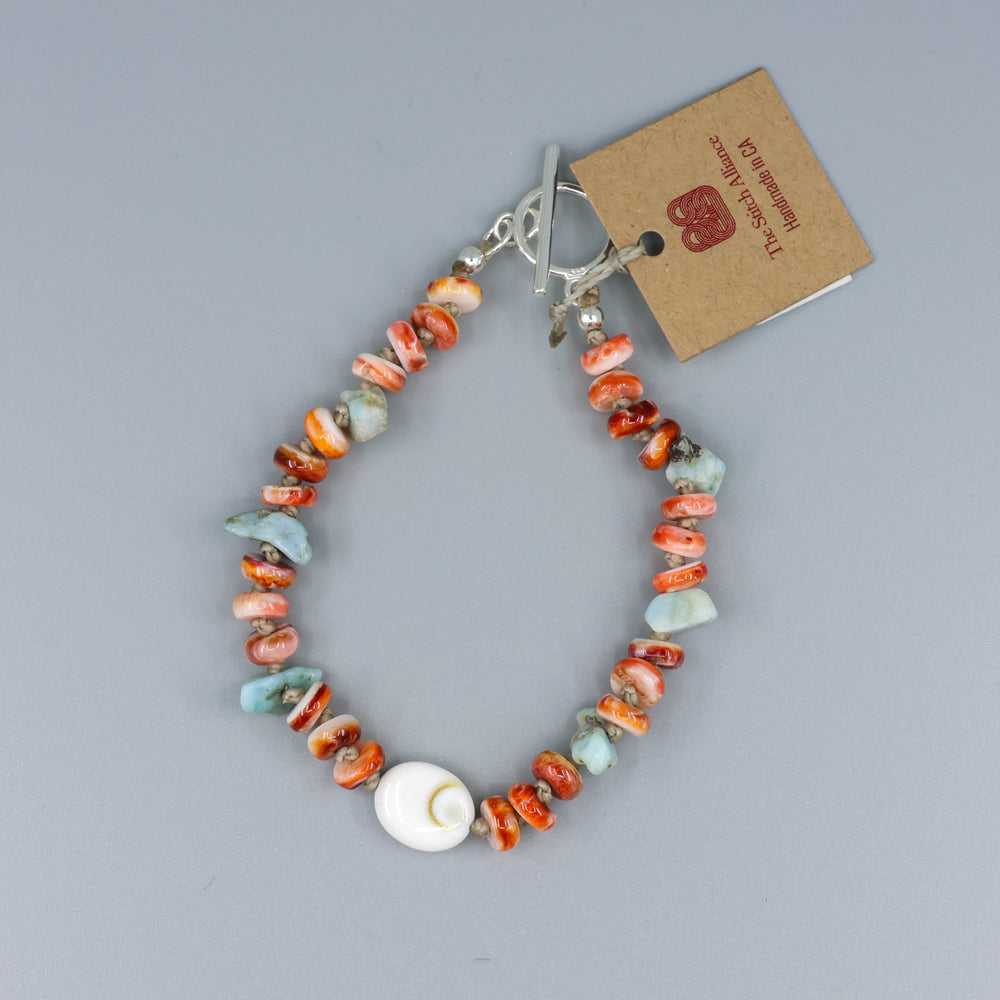 handmade shiva shell, larimar, and spiny oyster beaded bracelet with sterling silver