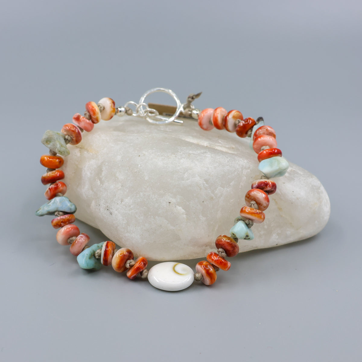 shiva shell, larimar, and spiny oyster hand-knotted bracelet with sterling silver