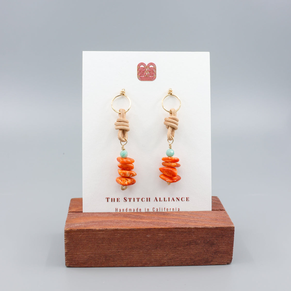 handmade gold, spiny oyster, and amazonite leather drop earrings 