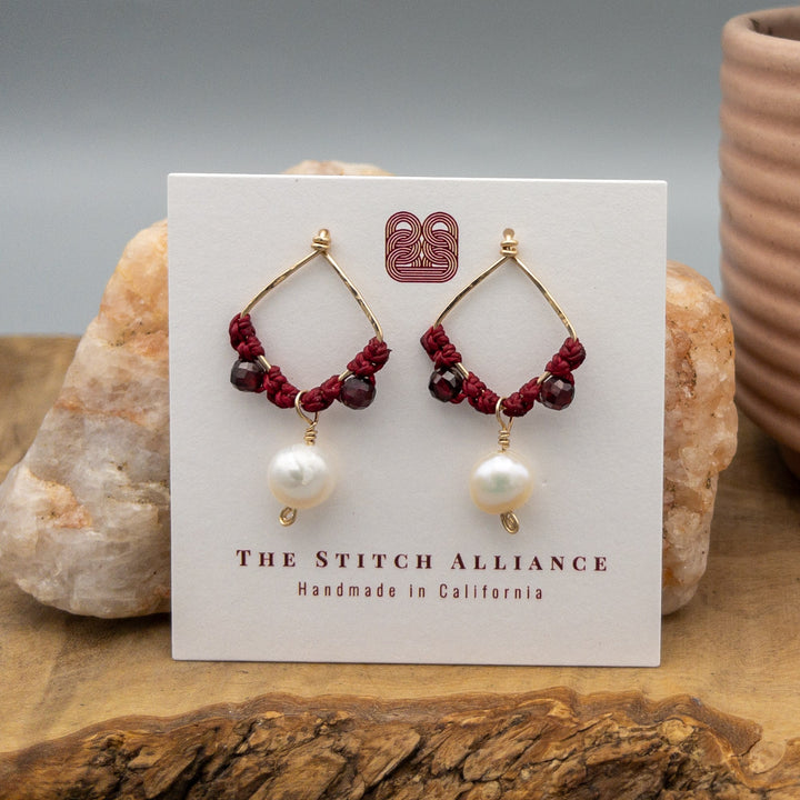 Garnet and freshwater pearl gold filled macrame earrings on a white card