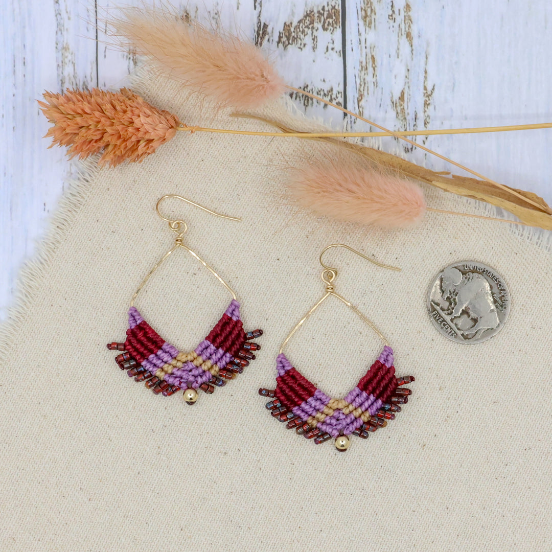 handmade square hoop statement earrings in gold fill with purple and red macrame shown with coin for size