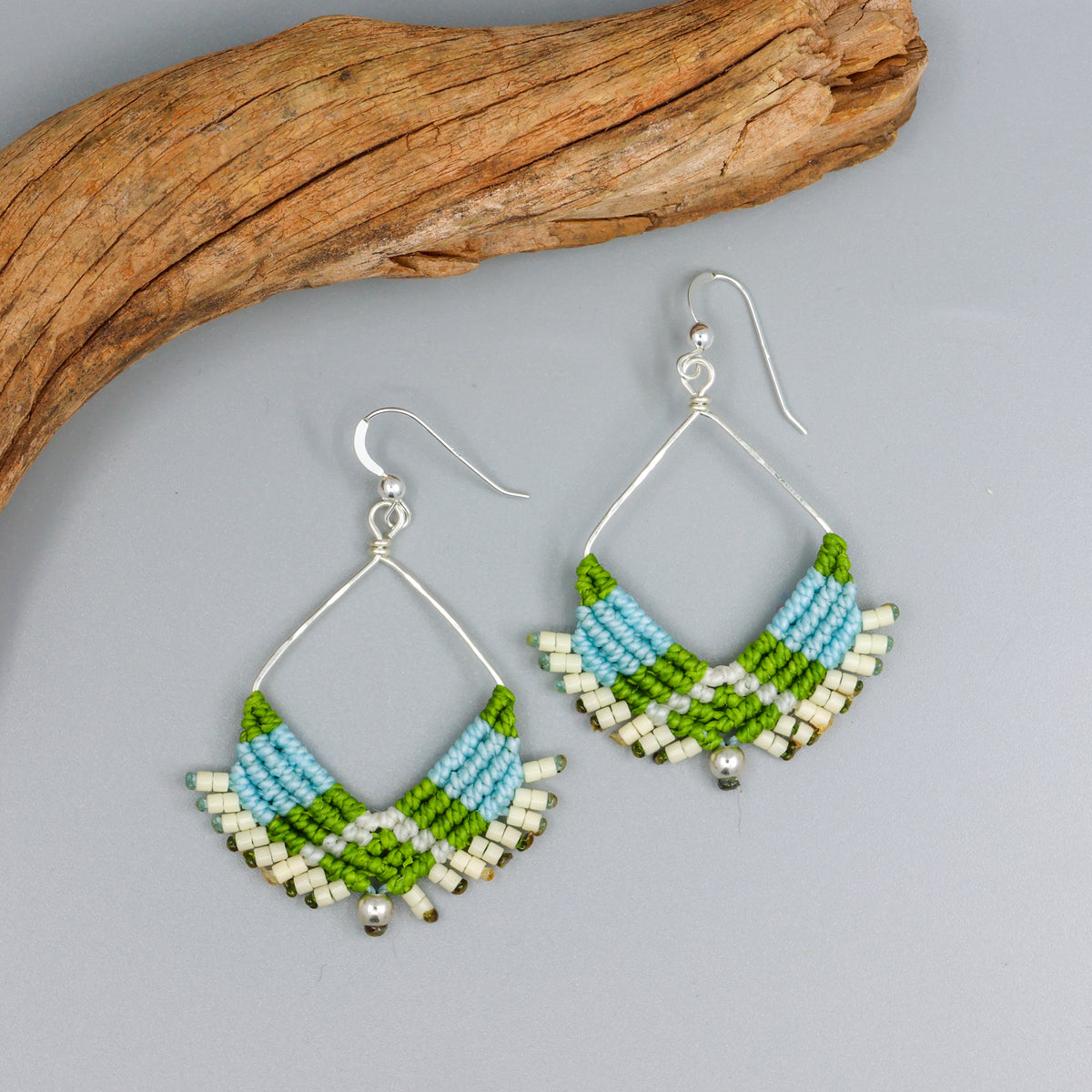 handmade sterling silver macrame hoop earrings in light blue, green, and cream