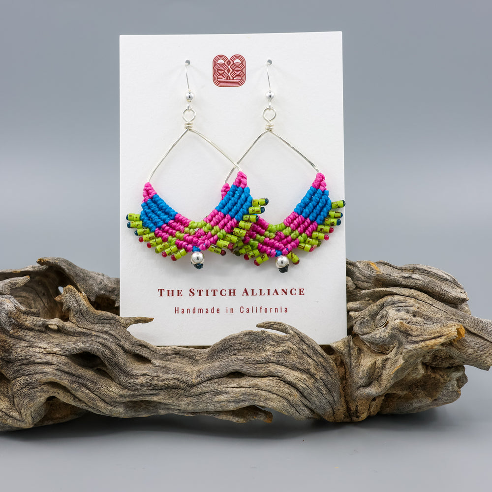 square hoop macrame earrings in tropical pink, green and blue colors on a white card