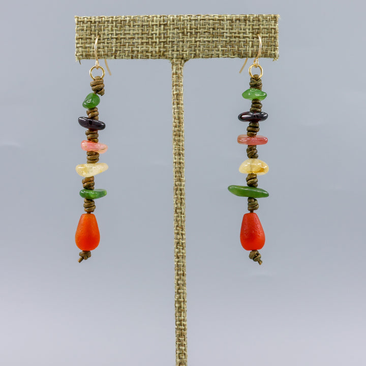 handmade autumn gemstone leather earrings with gold fill ear wires shown on a linen display hanger