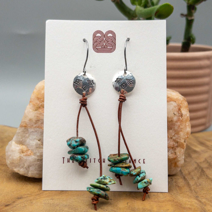 turquoise dangle earrings with hand stamped sterling silver disc and brown leather