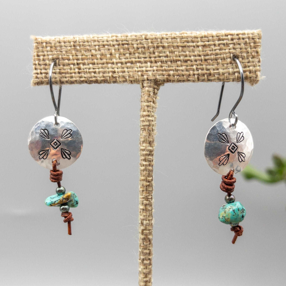 hand stamped sterling silver and turquoise drop earrings close up