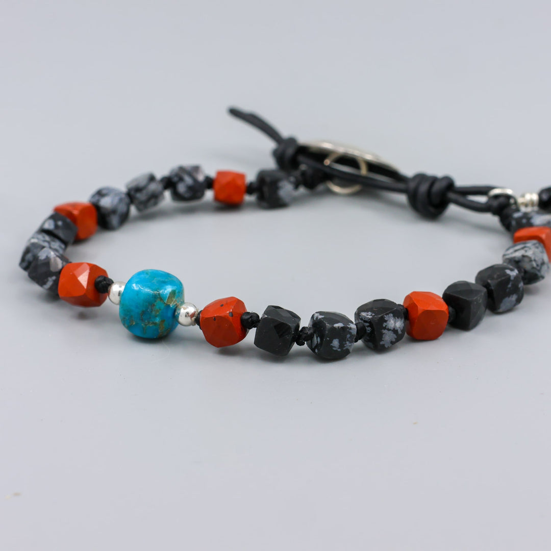 handmade turquoise, jasper, and larvikite beaded bracelet with a star-stamped sterling silver button closure  detail view